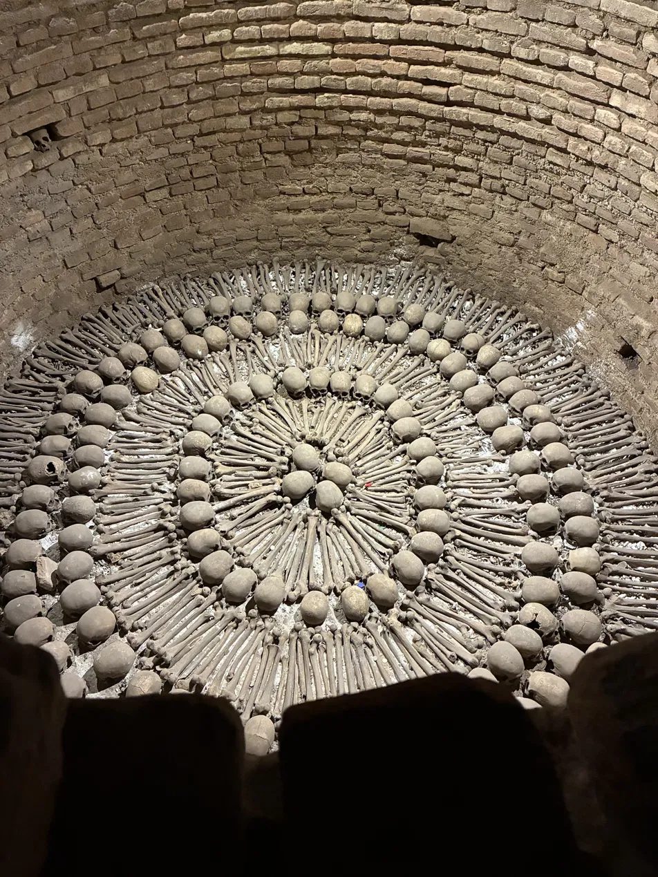 Bones arranged in a circular well in the catacombs beneath San Francisco